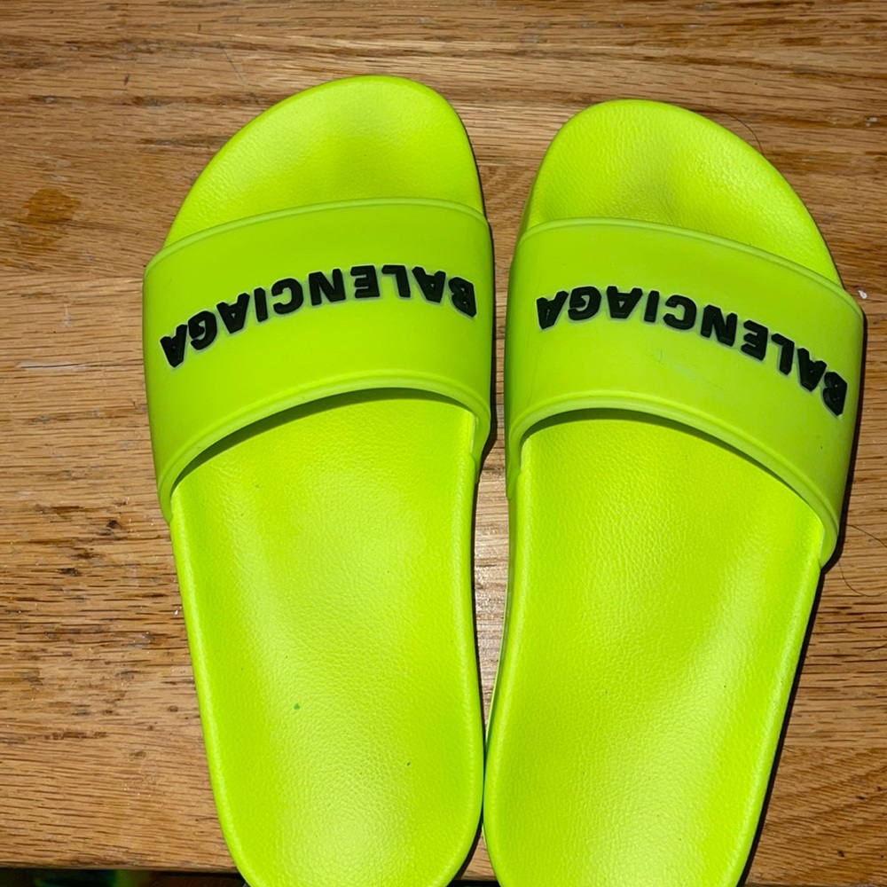 Neon green slides slightly worn , very small only worn to try it on to see